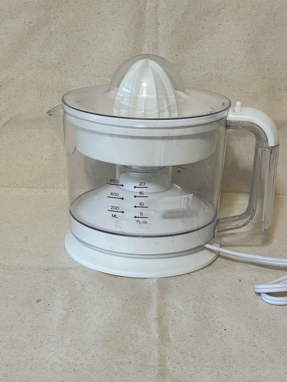 White Electric Citrus Juicer with Clear Measuring Container